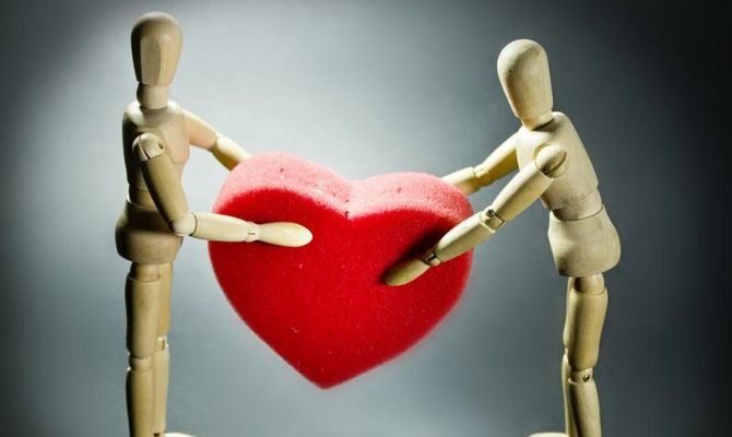 Bambole di legno con cuore